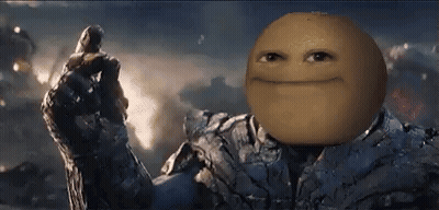 A Man In A Suit With A Smiley Face On His Face Is Holding A Glove . GIF