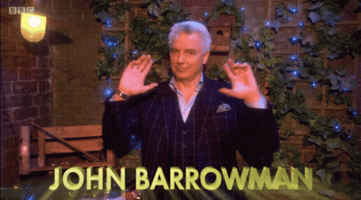 A Man In A Suit With The Name John Barrowman On The Screen GIF