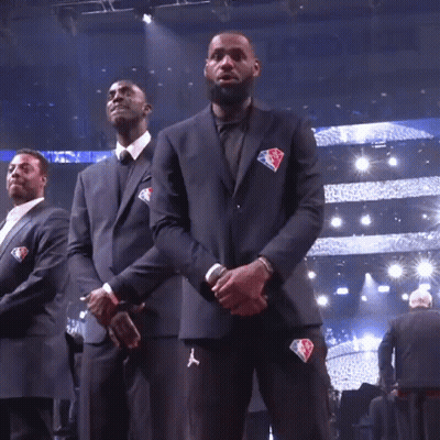 A Man In A Suit With The Nba Logo On His Jacket GIF