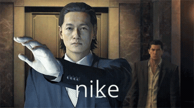 A Man In A Suit With The Word Nike On His Sleeve GIF