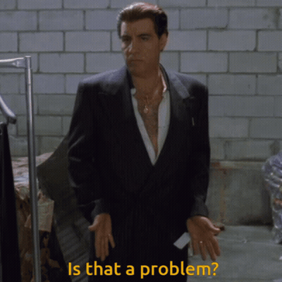 A Man In A Suit With The Words Is That A Problem Behind Him GIF