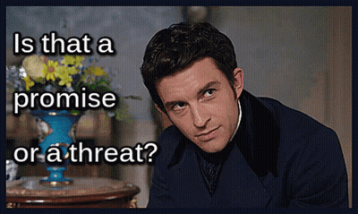 A Man In A Suit With The Words Is That A Promise Or A Threat Written Below Him GIF