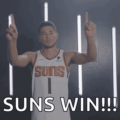 A Man In A Suns Jersey Holds Up His Fingers And Says Suns Win GIF