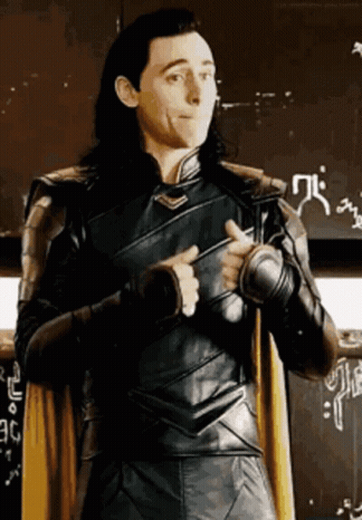A Man In A Superhero Costume Is Giving A Thumbs Up Sign . GIF