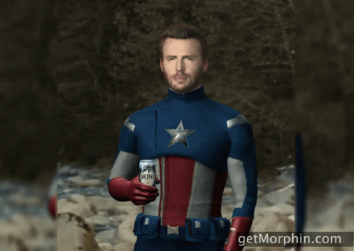 A Man In A Superhero Costume Is Holding A Can Of Drink GIF