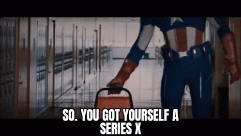 A Man In A Superhero Costume Is Holding A Chair And Says So You Got Yourself A Series X GIF