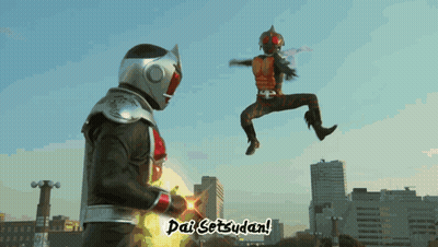 A Man In A Superhero Costume Is Jumping In The Air While Another Man Says Dai Setzudan GIF