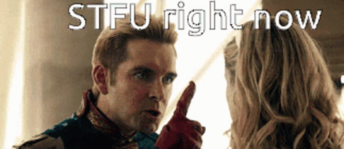 A Man In A Superhero Costume Is Pointing At A Woman With The Words Stfu Right Now Above Him GIF