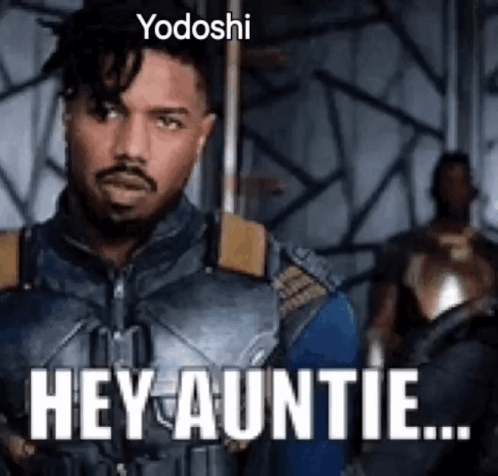 A Man In A Superhero Costume Is Saying `` Hey Auntie '' While Holding A Sword . GIF
