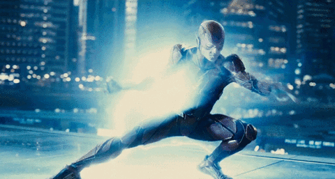 A Man In A Superhero Costume Is Shooting A Lightning Bolt GIF