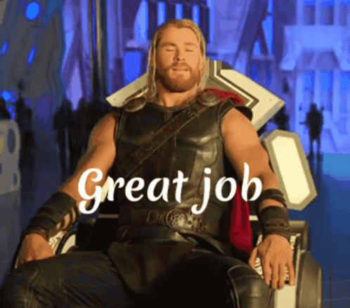 A Man In A Superhero Costume Is Sitting In A Chair With The Words " Great Job " Written Above Him GIF
