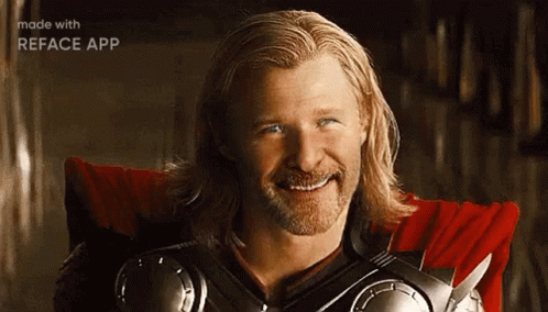 A Man In A Superhero Costume Is Smiling . GIF