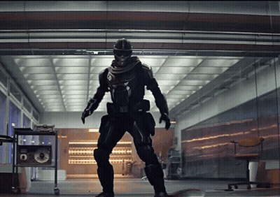 A Man In A Superhero Costume Is Standing In A Hallway GIF