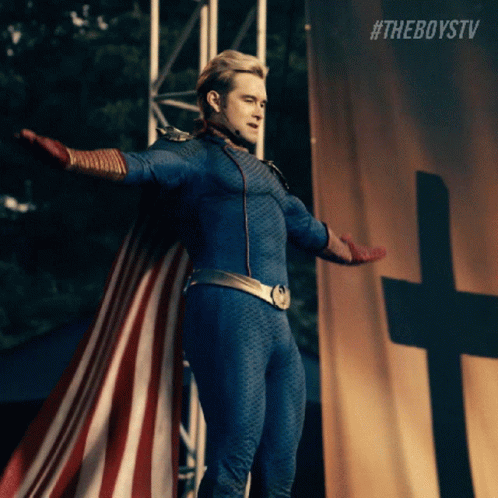 A Man In A Superhero Costume Is Standing In Front Of A Cross With His Arms Outstretched .. GIF