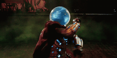 A Man In A Superhero Costume Is Standing In Front Of A Green Glowing Sphere . GIF
