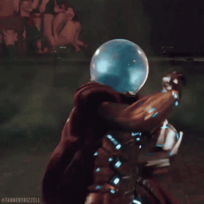 A Man In A Superhero Costume Is Surrounded By Green Smoke And A Glass Ball On His Head . GIF