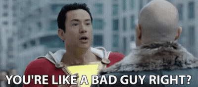 A Man In A Superhero Costume Is Talking To Another Man In A Fur Coat In A Movie Scene . GIF