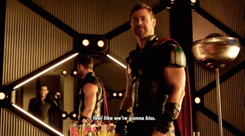 A Man In A Superhero Costume Says " I Feel Like We 'Re Gonna Kiss " In Front Of A Mirror GIF