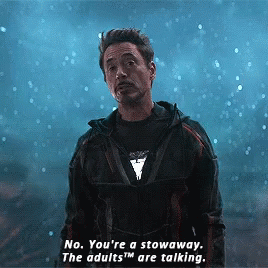 A Man In A Superhero Costume Says No You 'Re A Stowaway The Adults Are Talking . GIF
