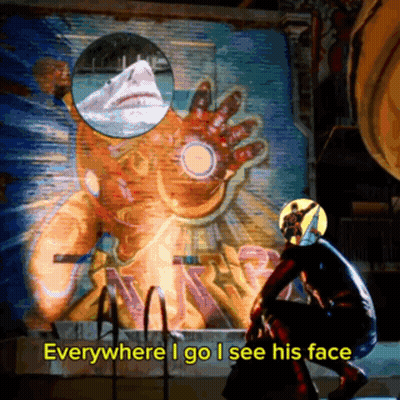 A Man In A Superhero Costume Stands In Front Of A Painting Of Iron Man GIF