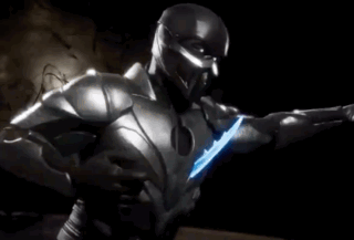 A Man In A Superhero Costume With A Light On His Chest GIF