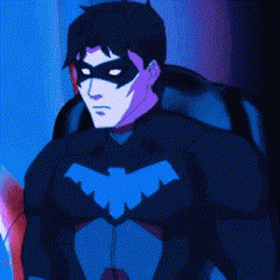 A Man In A Superhero Costume With A Mask On His Face . GIF