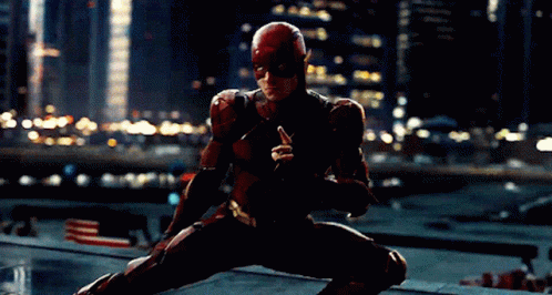 A Man In A Superhero Suit Is Kneeling Down GIF