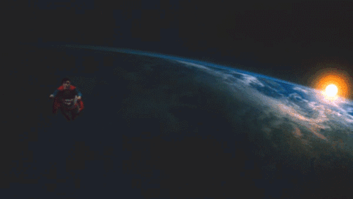 A Man In A Superman Cape Flies Over The Earth GIF