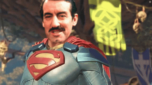 A Man In A Superman Costume With A Mustache GIF