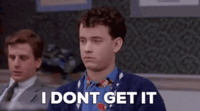 A Man In A Sweater And Tie Is Sitting In Front Of A Chalkboard And Says `` I Dont Get It '' . GIF