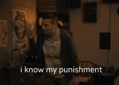 A Man In A Sweater Holds A White Object In His Hand And Says " I Know My Punishment " GIF