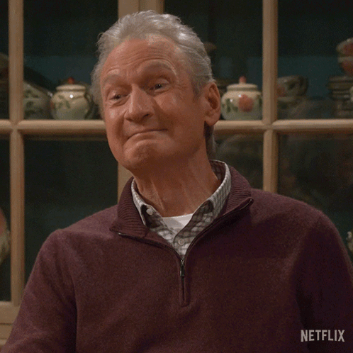 A Man In A Sweater Says Precious Moments On A Netflix Poster GIF