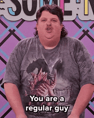 A Man In A T-Shirt That Says You Are A Regular Guy GIF