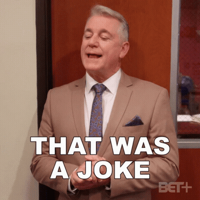 A Man In A Tan Suit And Tie Says That Was A Joke GIF