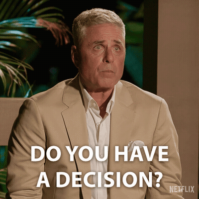 A Man In A Tan Suit Is Asking If He Has A Decision GIF