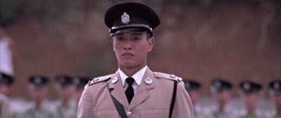 A Man In A Tan Uniform Has A Badge On His Hat That Says ' A ' On It GIF