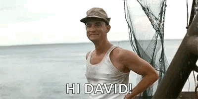 A Man In A Tank Top And Hat Is Standing On A Boat In The Ocean And Saying `` Hi David '' . GIF