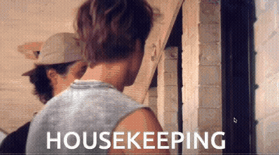 A Man In A Tank Top Is Standing Next To Another Man In A Hat And The Words Housekeeping Are Displayed On The Screen GIF
