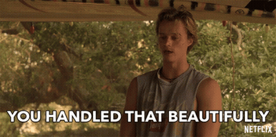 A Man In A Tank Top With The Words " You Handled That Beautifully " On The Bottom GIF