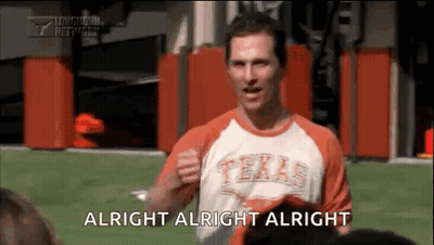 A Man In A Texas Shirt Is Standing On A Field And Says Alright Alright Alright . GIF