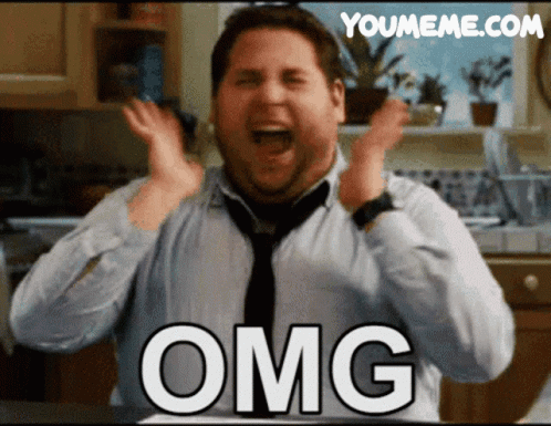A Man In A Tie Is Making A Funny Face With The Word Omg On His Chest GIF