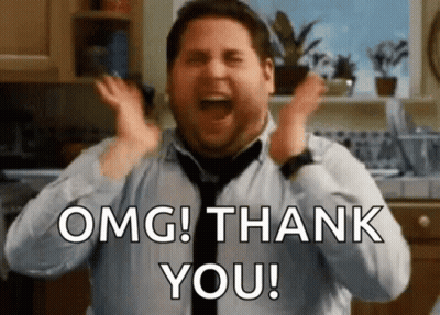 A Man In A Tie Is Screaming And Saying `` Omg ! Thank You ! '' In A Kitchen . GIF