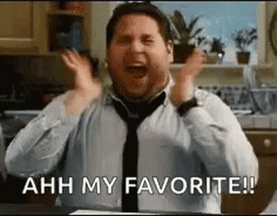 A Man In A Tie Is Screaming With His Hands In The Air And The Words `` Ahh My Favorite ! '' GIF