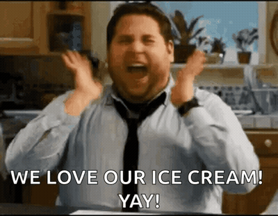 A Man In A Tie Is Screaming With His Hands In The Air While Saying We Love Our Ice Cream ! Yay ! GIF
