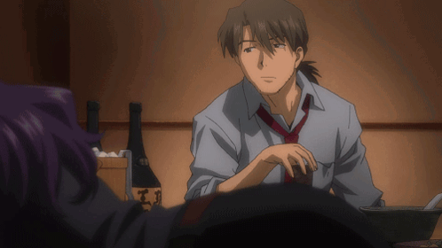 A Man In A Tie Sits At A Table In Front Of A Bottle That Says ' Ts ' On It GIF
