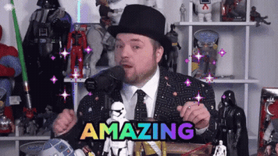 A Man In A Top Hat And Tie Is Holding A Sign That Says Amazing GIF
