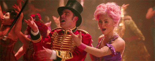 A Man In A Top Hat Is Dancing With A Woman In A Purple Dress GIF