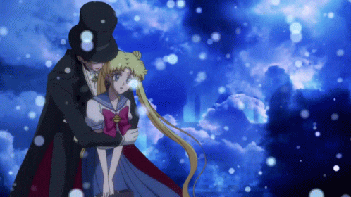 A Man In A Top Hat Is Hugging A Girl In A Sailor Uniform GIF