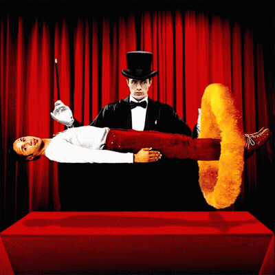 A Man In A Top Hat Is Performing A Trick With A Chicken Ring GIF