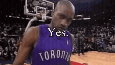 A Man In A Toronto Raptors Jersey Is Standing On A Basketball Court With A Basketball Hoop In The Background . GIF